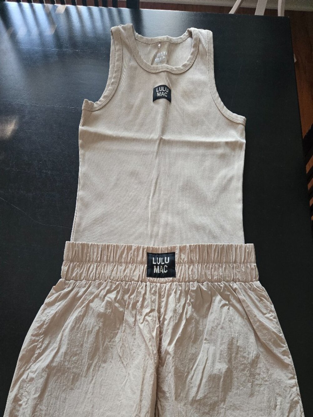 LULUMAC set in a creamy beige/tan color: nylon shorts and tank top